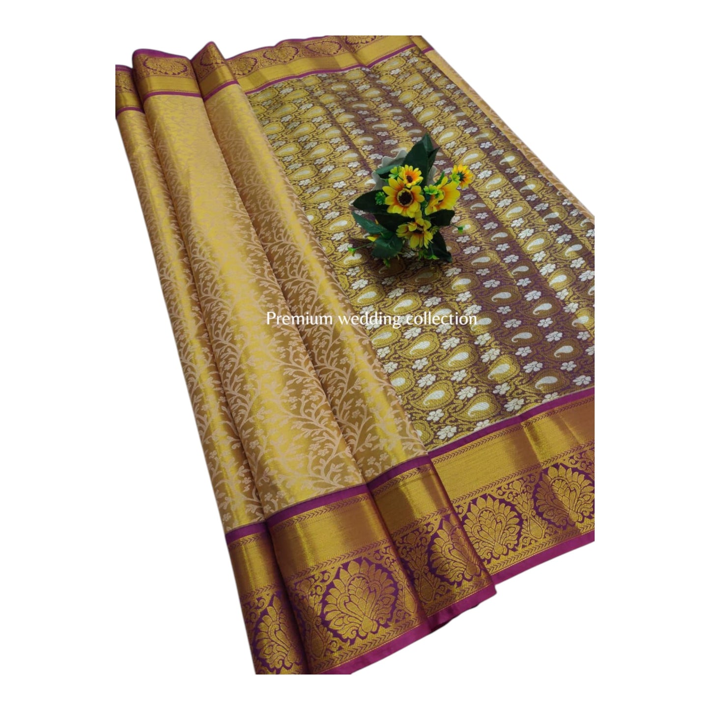 Gold and brown saree with floral design on a white background