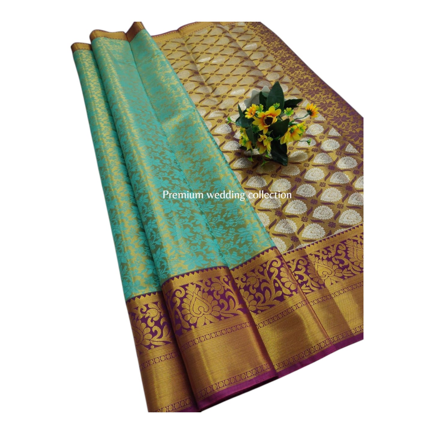 Turquoise and gold saree with decorative patterns on a white background