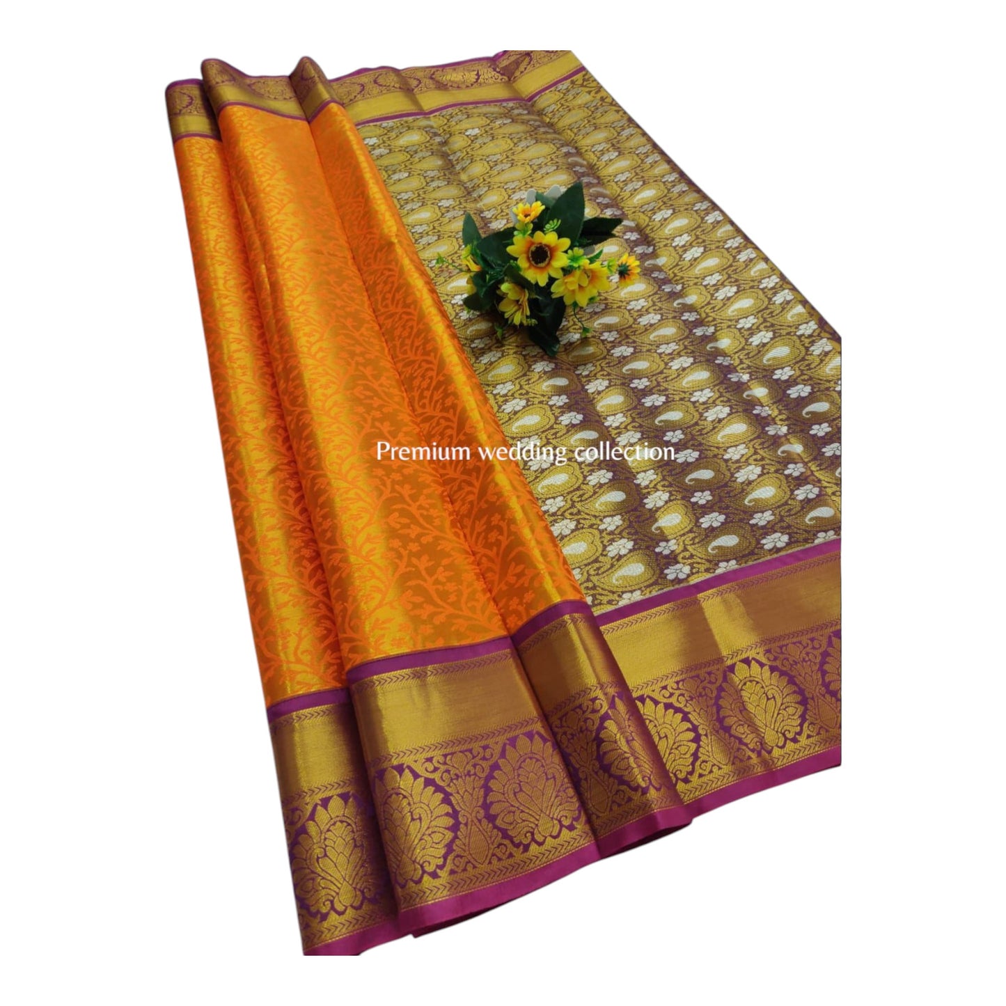 Orange and gold saree with floral arrangement on a white background