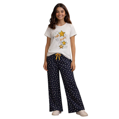 For She - Avalukaaga navy blue polka dot wide leg pajama pants with yellow drawstring waist.